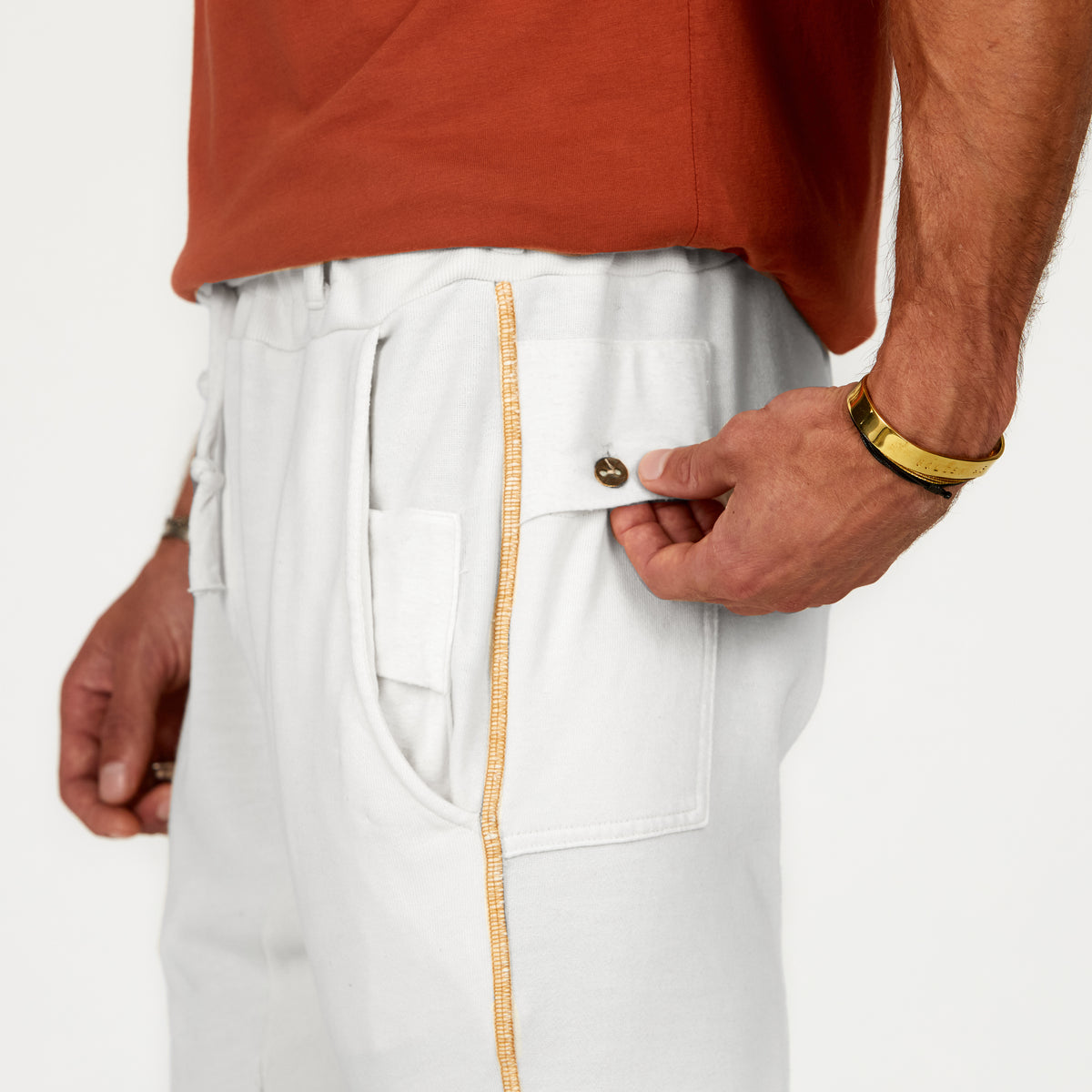 Man modeling the milano pant in pure white