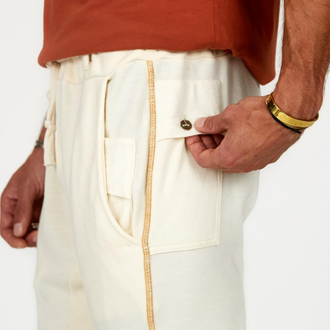 Man modeling the milano pant in white stone