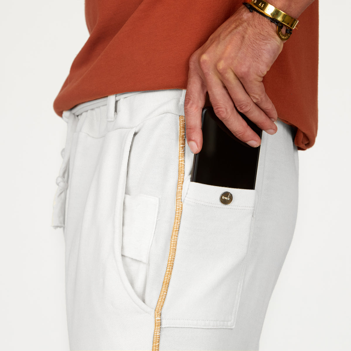 Man modeling the milano pant in pure white