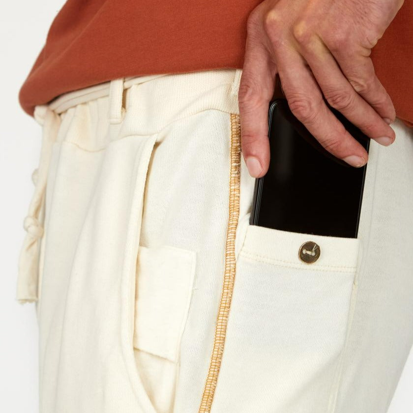 Man modeling the milano pant in white stone