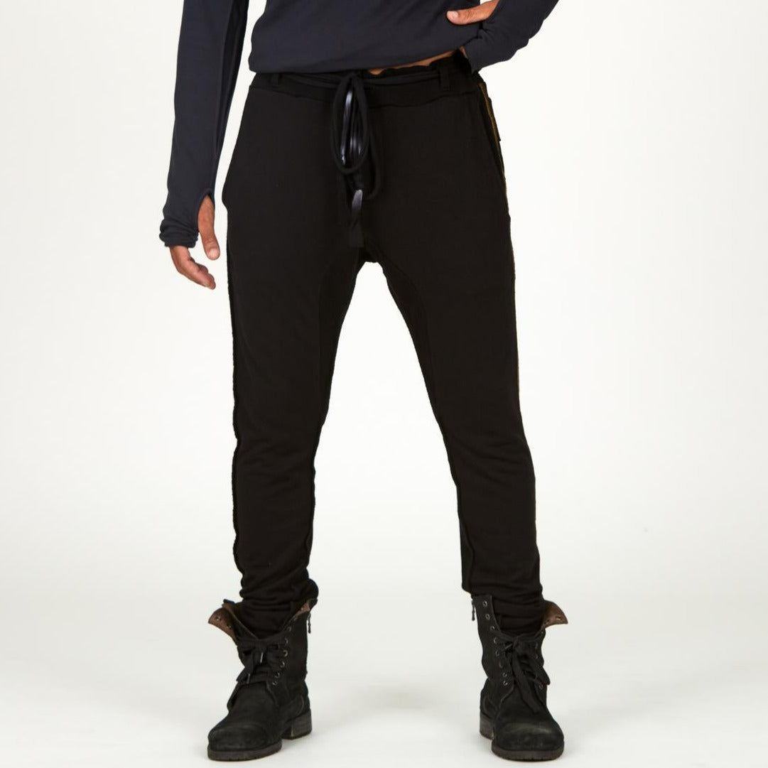 Man modeling a milano pants in black