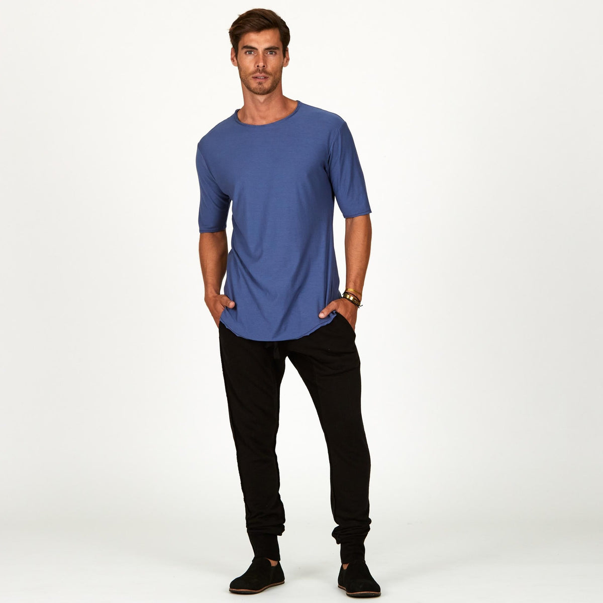 Male modeling blue crew neck shirt