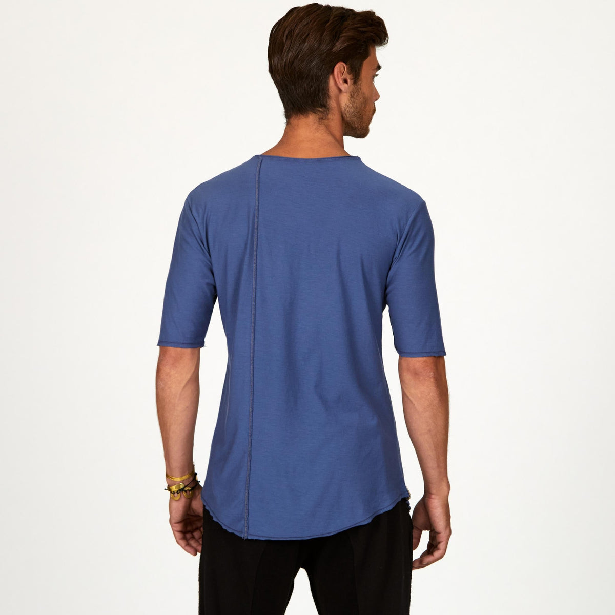 Male modeling blue crew neck shirt
