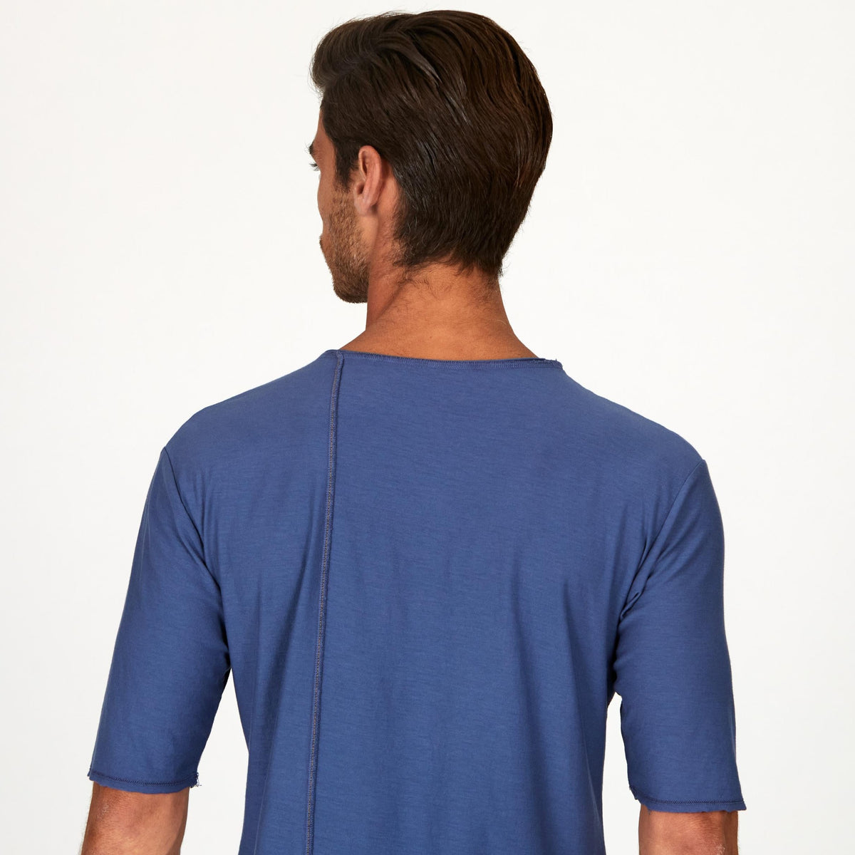 Male modeling blue crew neck shirt