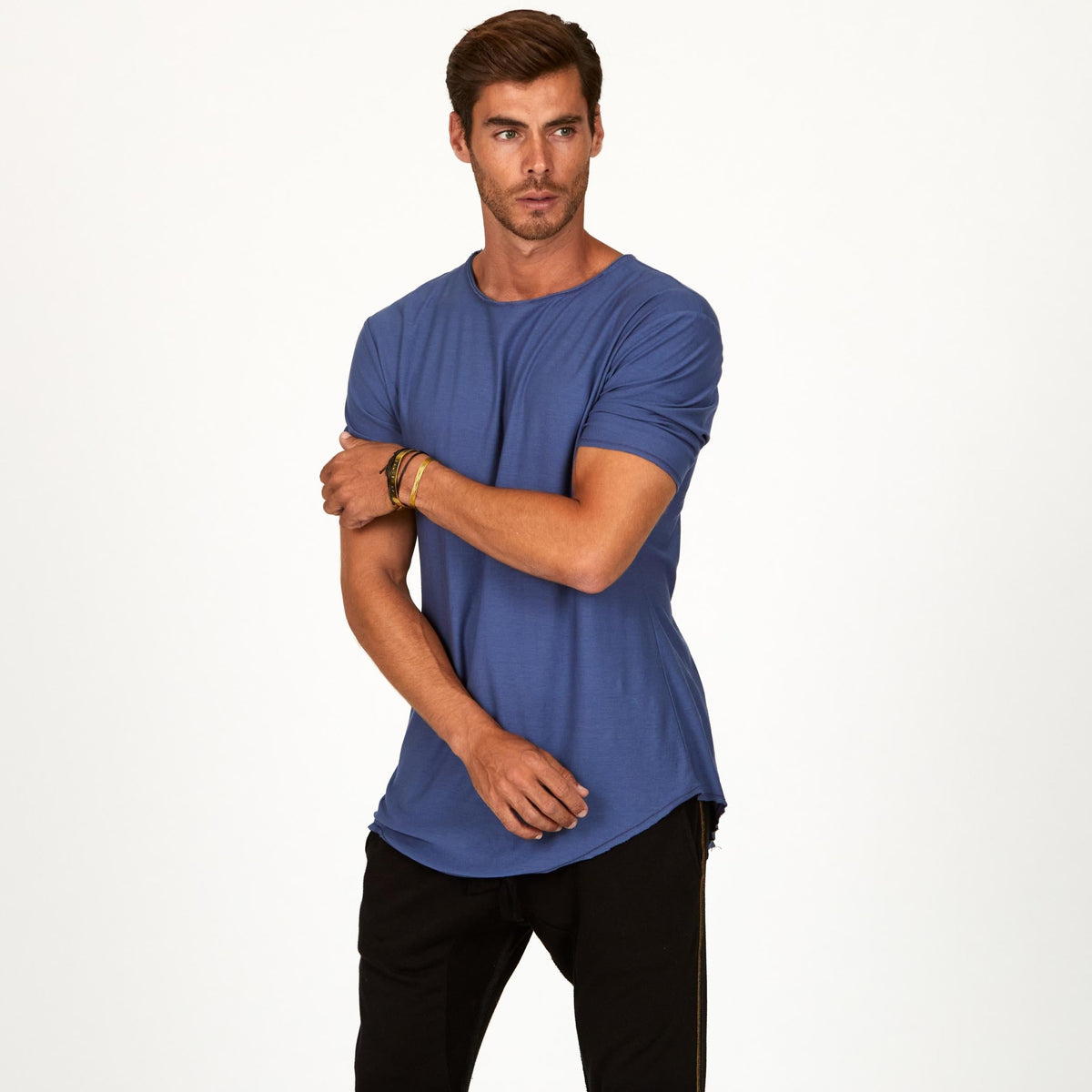 Male modeling blue crew neck shirt
