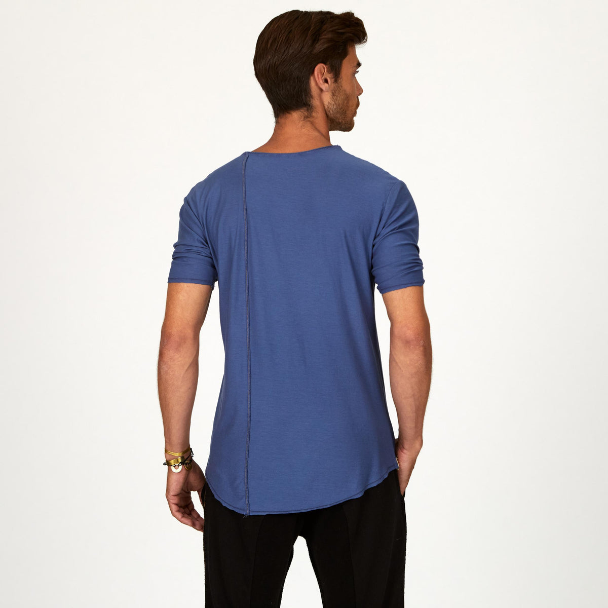 Male modeling blue crew neck shirt