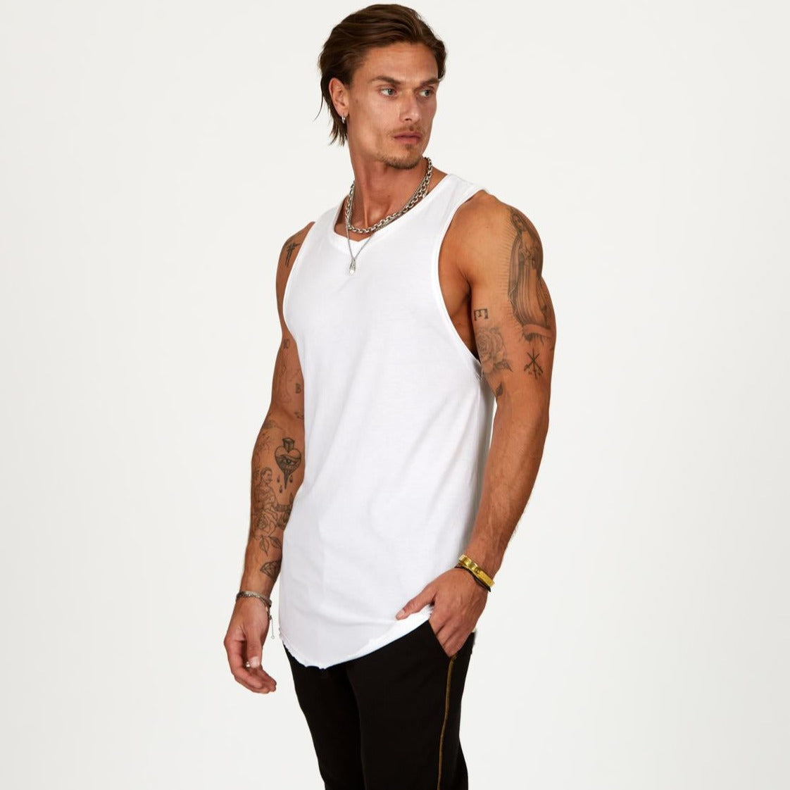 A man modeling a white tank top