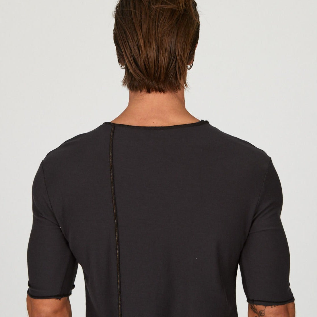 Male modeling black crew neck shirt