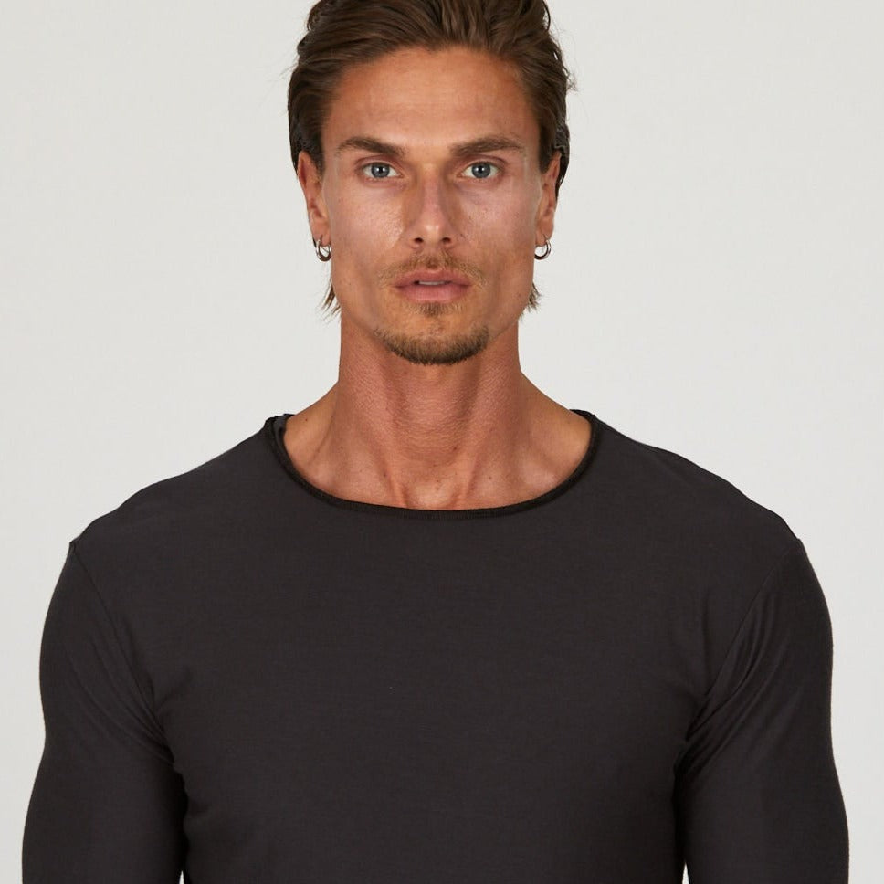 Male modeling black crew neck shirt