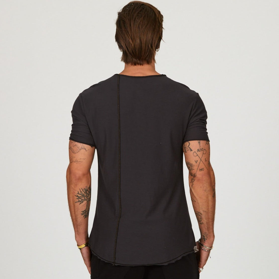 Male modeling black crew neck shirt