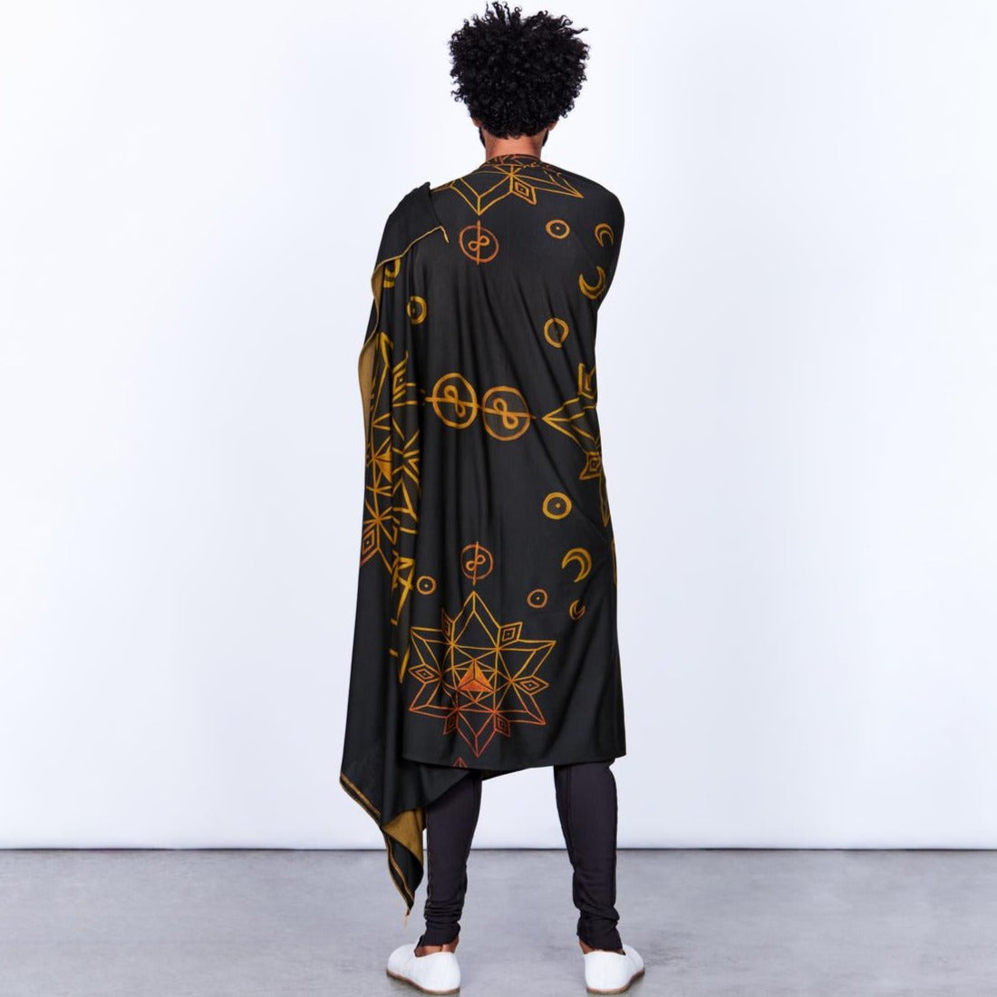 Male modeling gold on black nature wrap