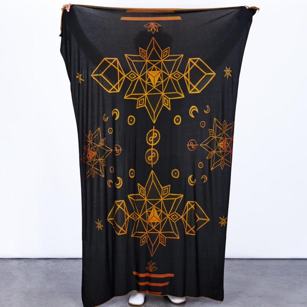 Male modeling gold on black nature wrap
