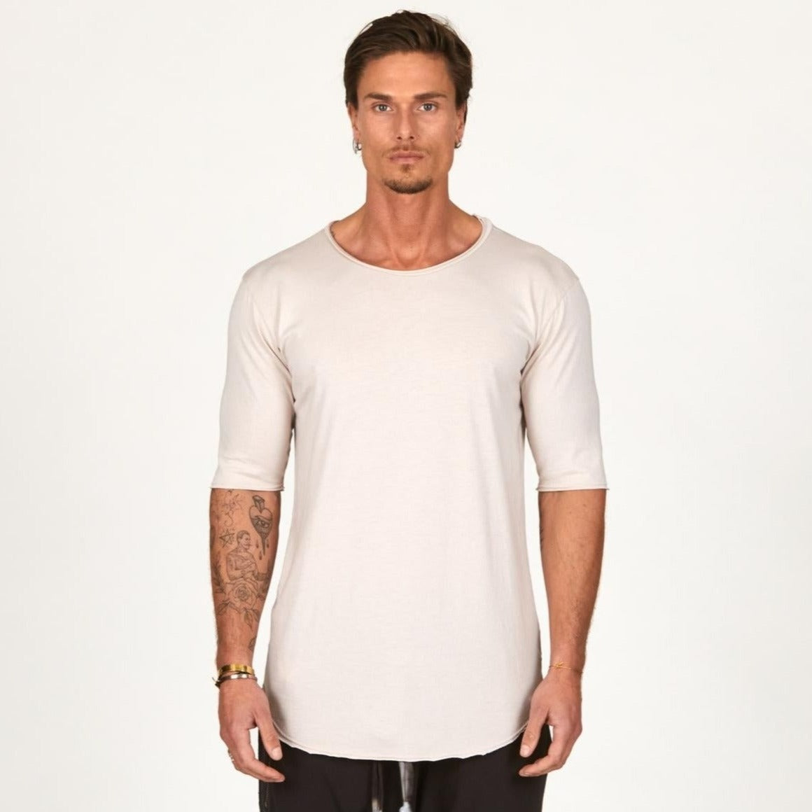 Man modeling a long sleeve shirt in white