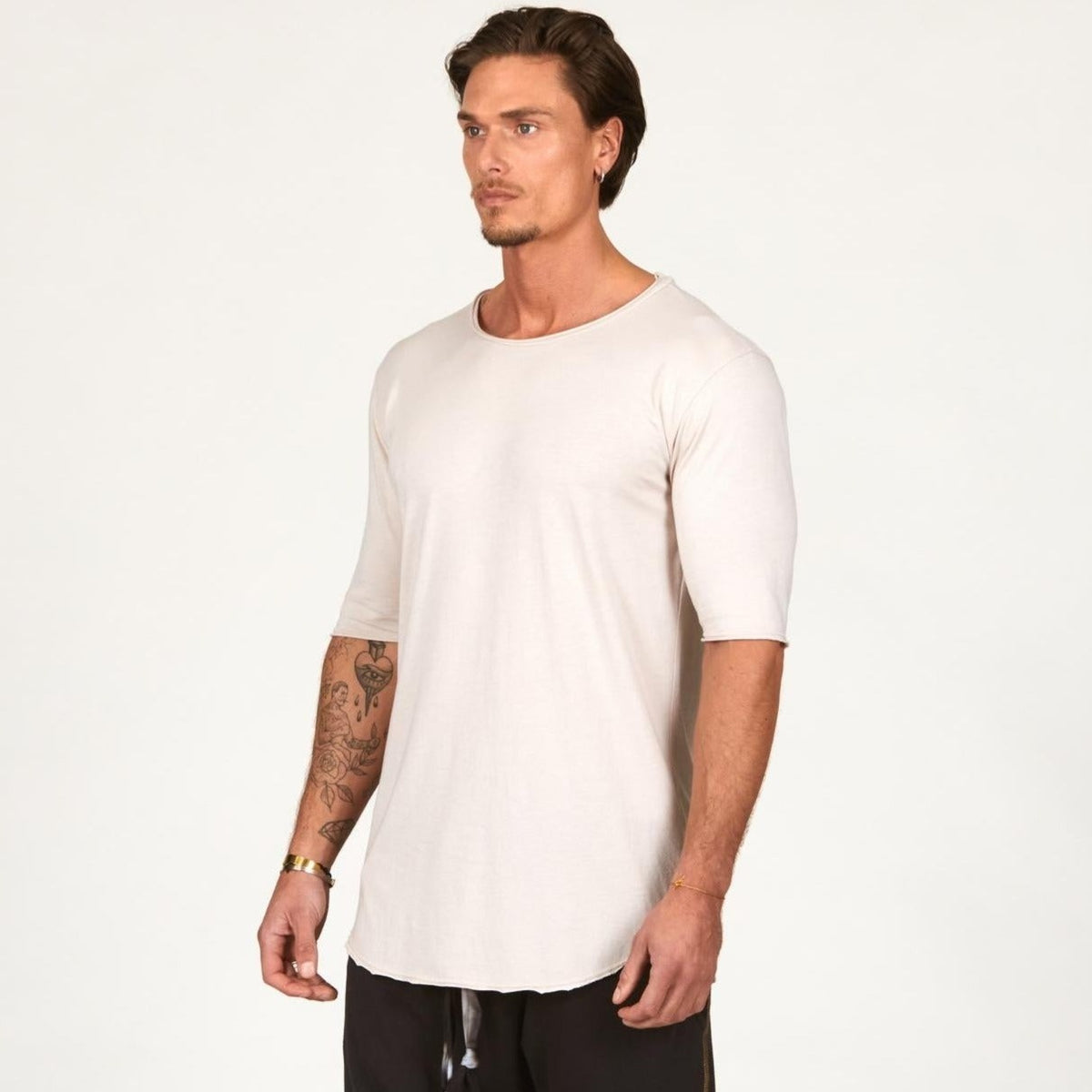 Man modeling a long sleeve shirt in white