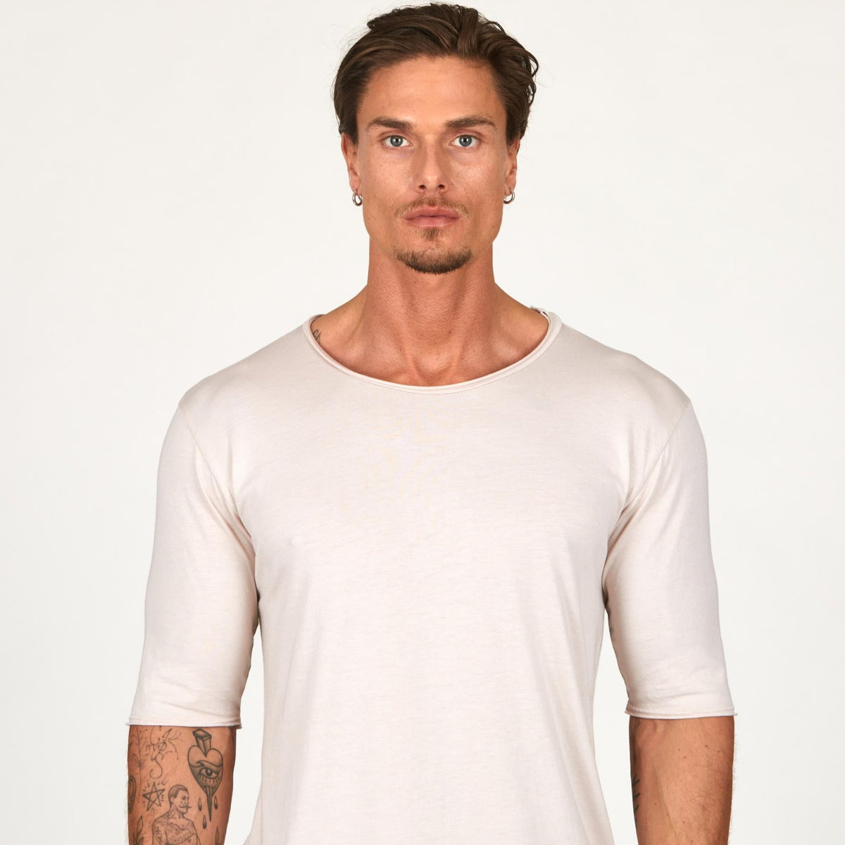 Man modeling a long sleeve shirt in white
