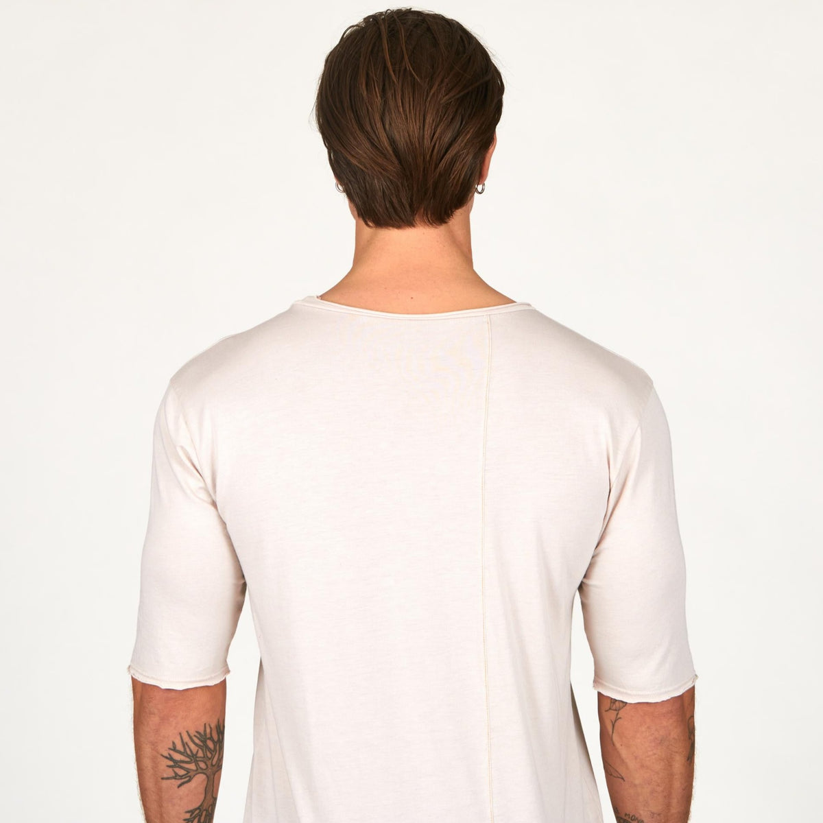 Man modeling a long sleeve shirt in white