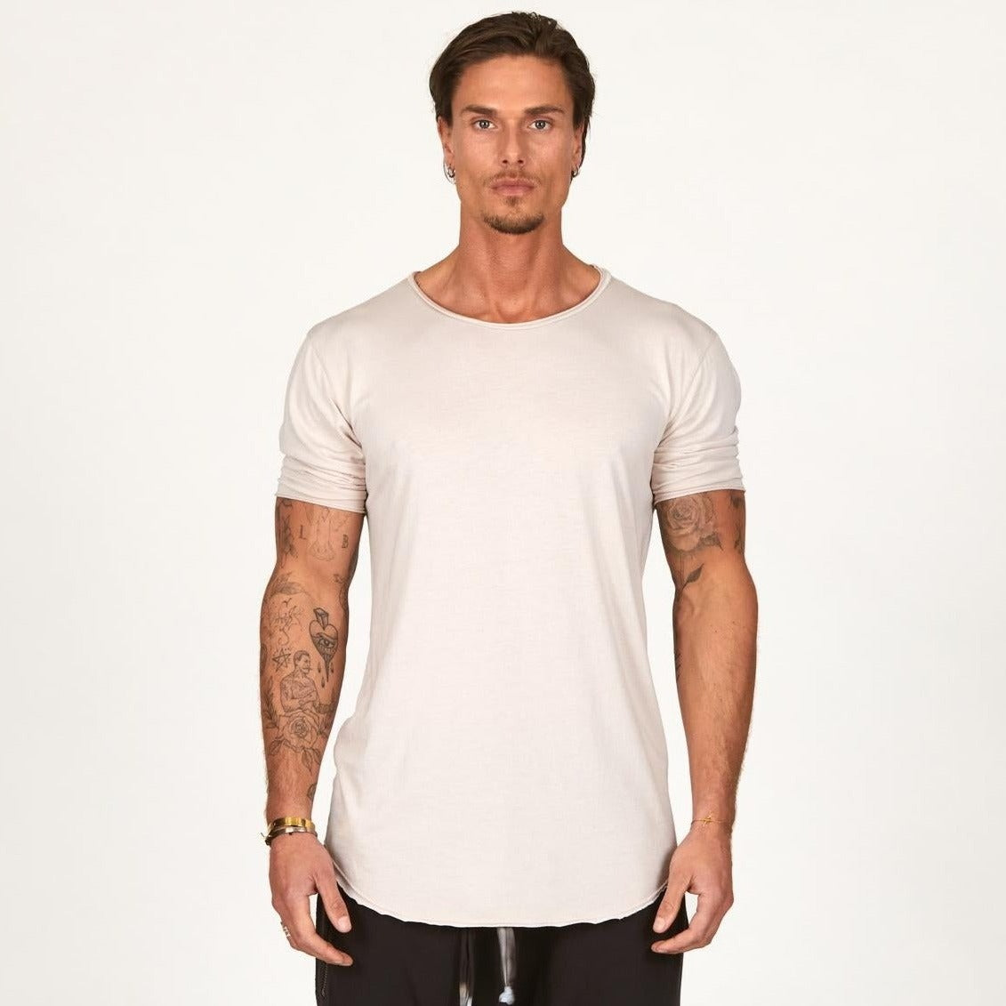 Man modeling a long sleeve shirt in white