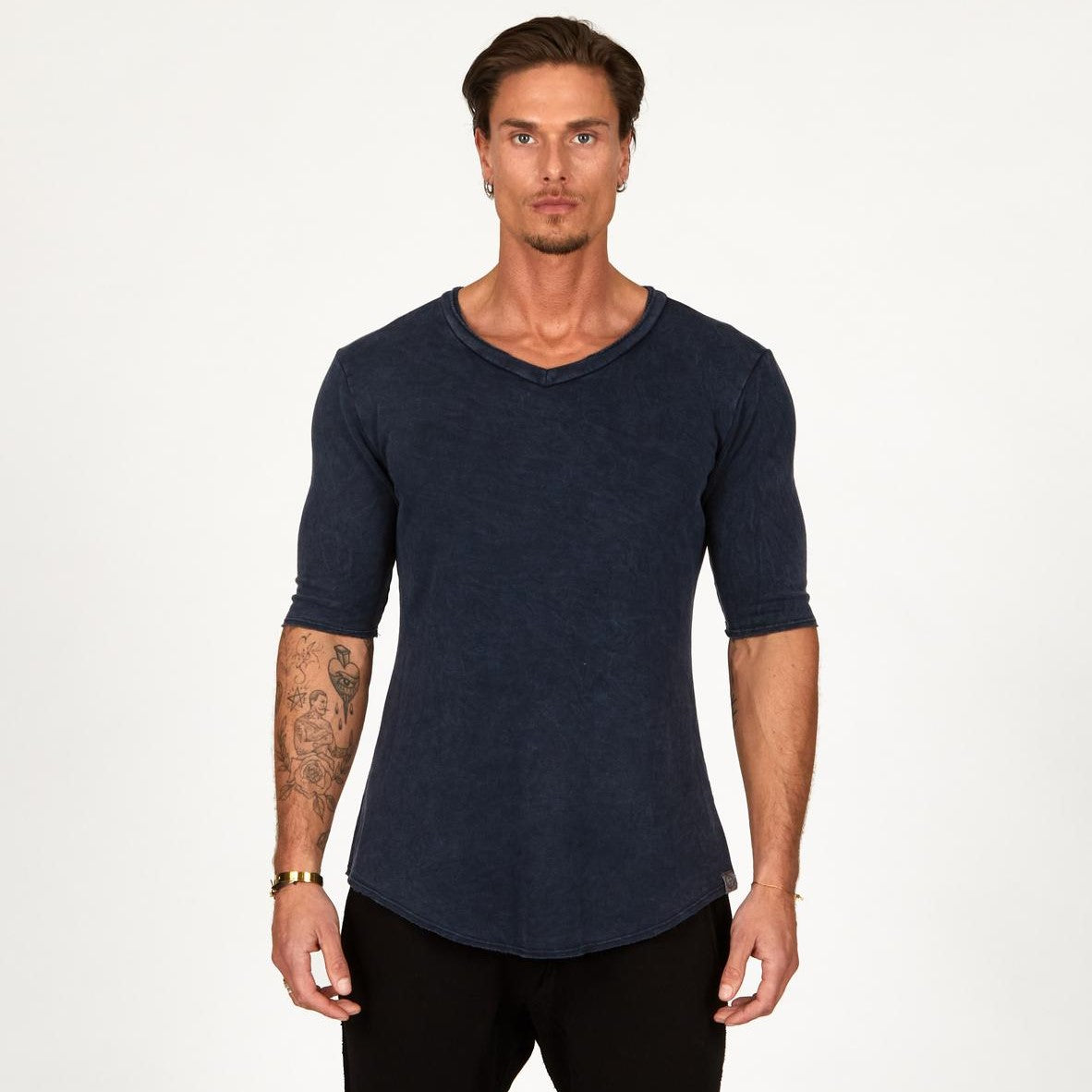 A man wearing the One Golden Thread Fleece Sweater v neck shirt in   blue mineral color