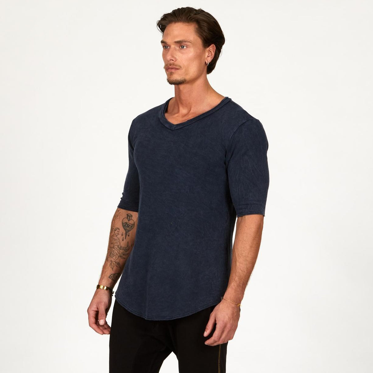 A man wearing the One Golden Thread Fleece Sweater v neck shirt in   blue mineral color