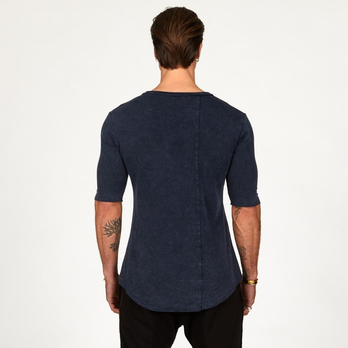 A man wearing the One Golden Thread Fleece Sweater v neck shirt in   blue mineral color