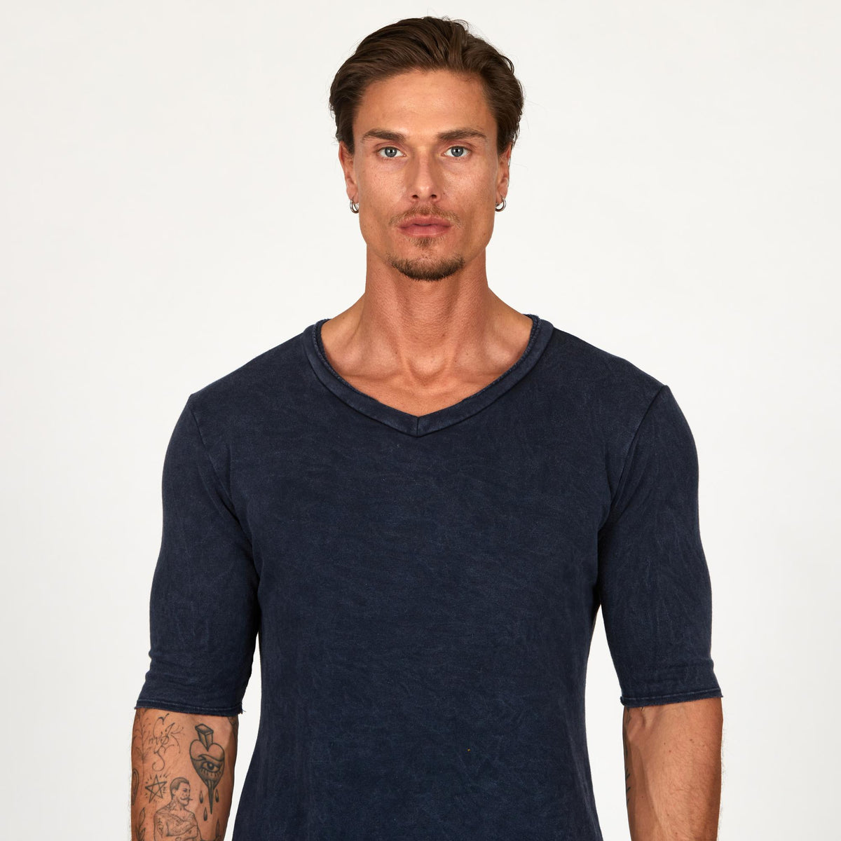 A man wearing the One Golden Thread Fleece Sweater v neck shirt in   blue mineral color