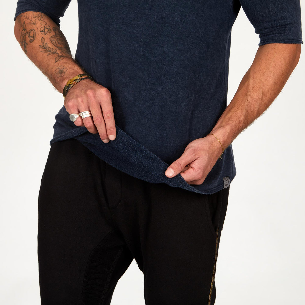 A man wearing the One Golden Thread Fleece Sweater v neck shirt in   blue mineral color