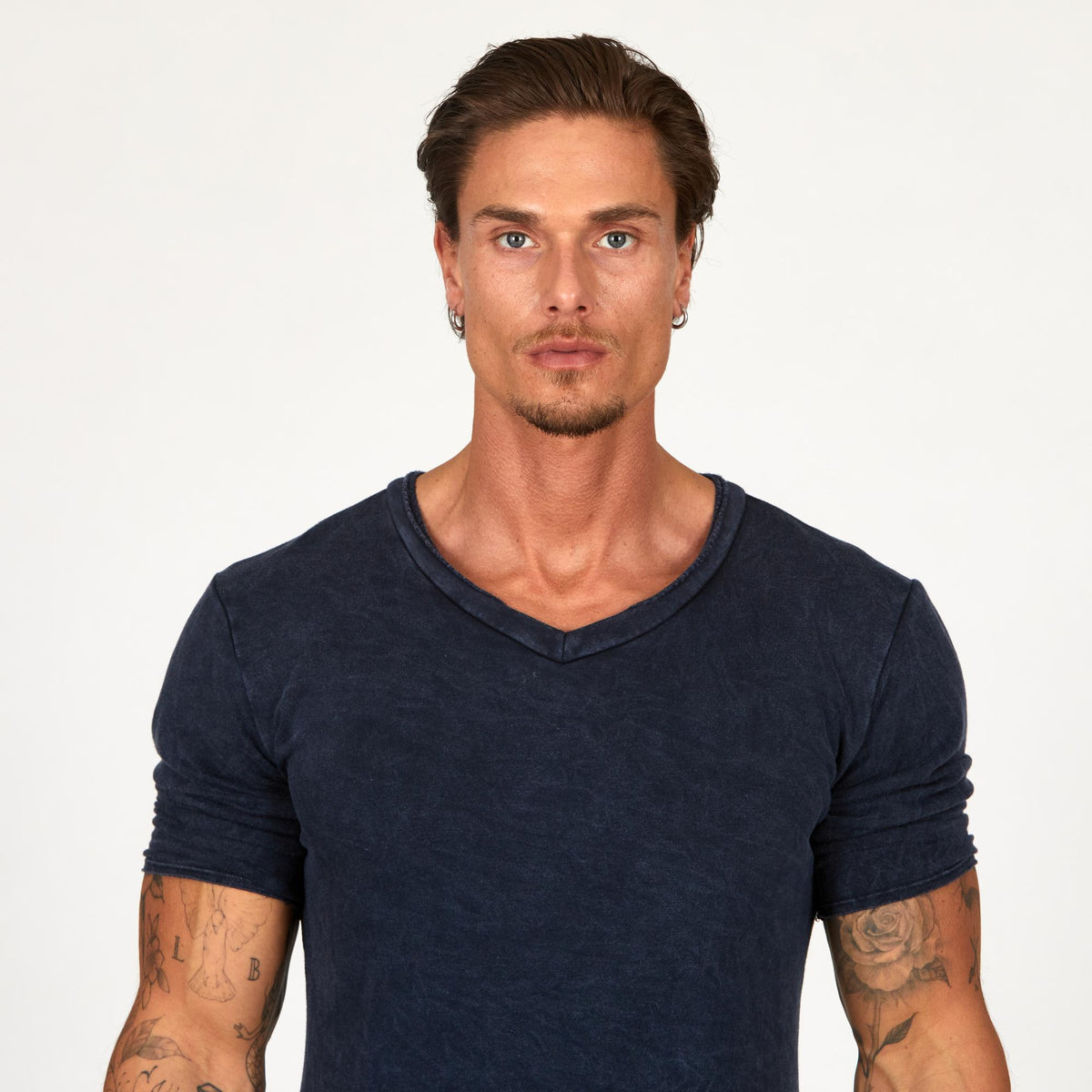 A man wearing the One Golden Thread Fleece Sweater v neck shirt in   blue mineral color