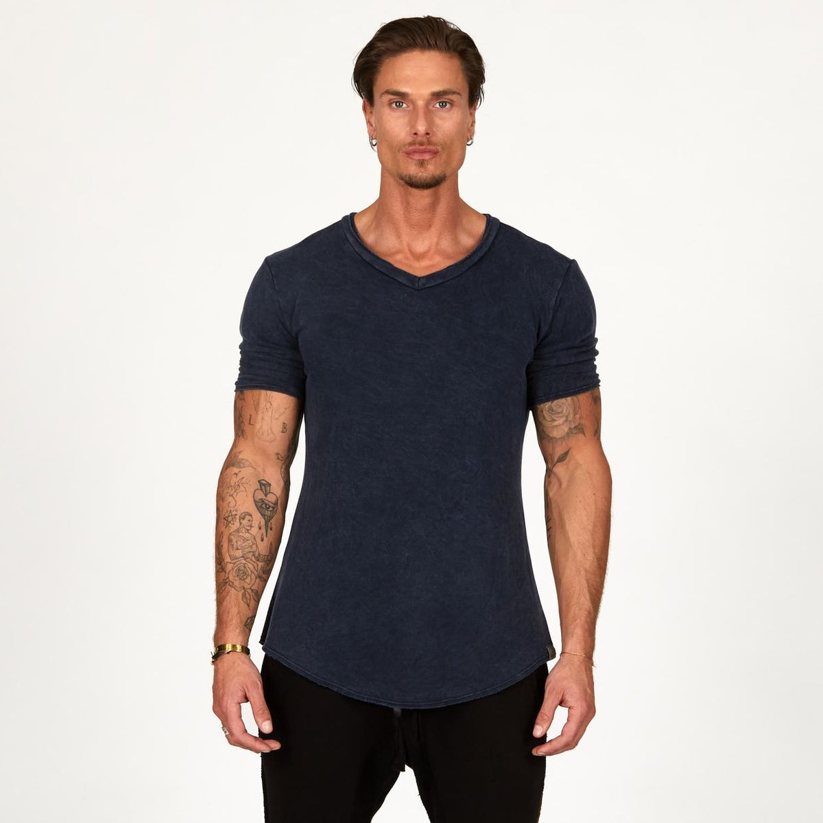 A man wearing the One Golden Thread Fleece Sweater v neck shirt in   blue mineral color