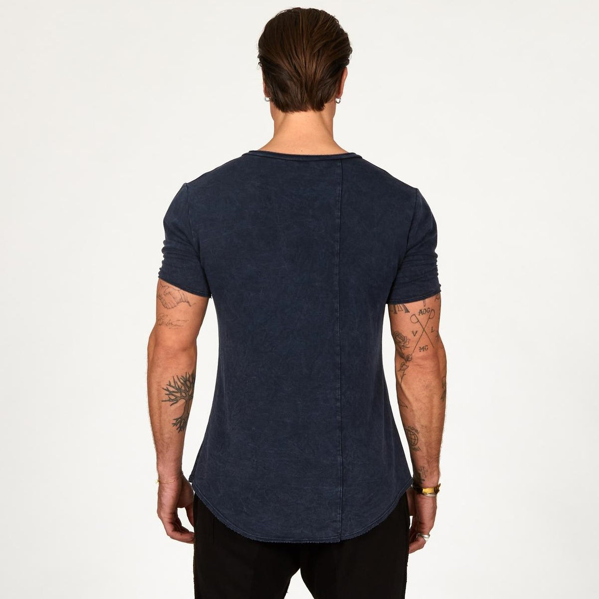 A man wearing the One Golden Thread Fleece Sweater v neck shirt in   blue mineral color