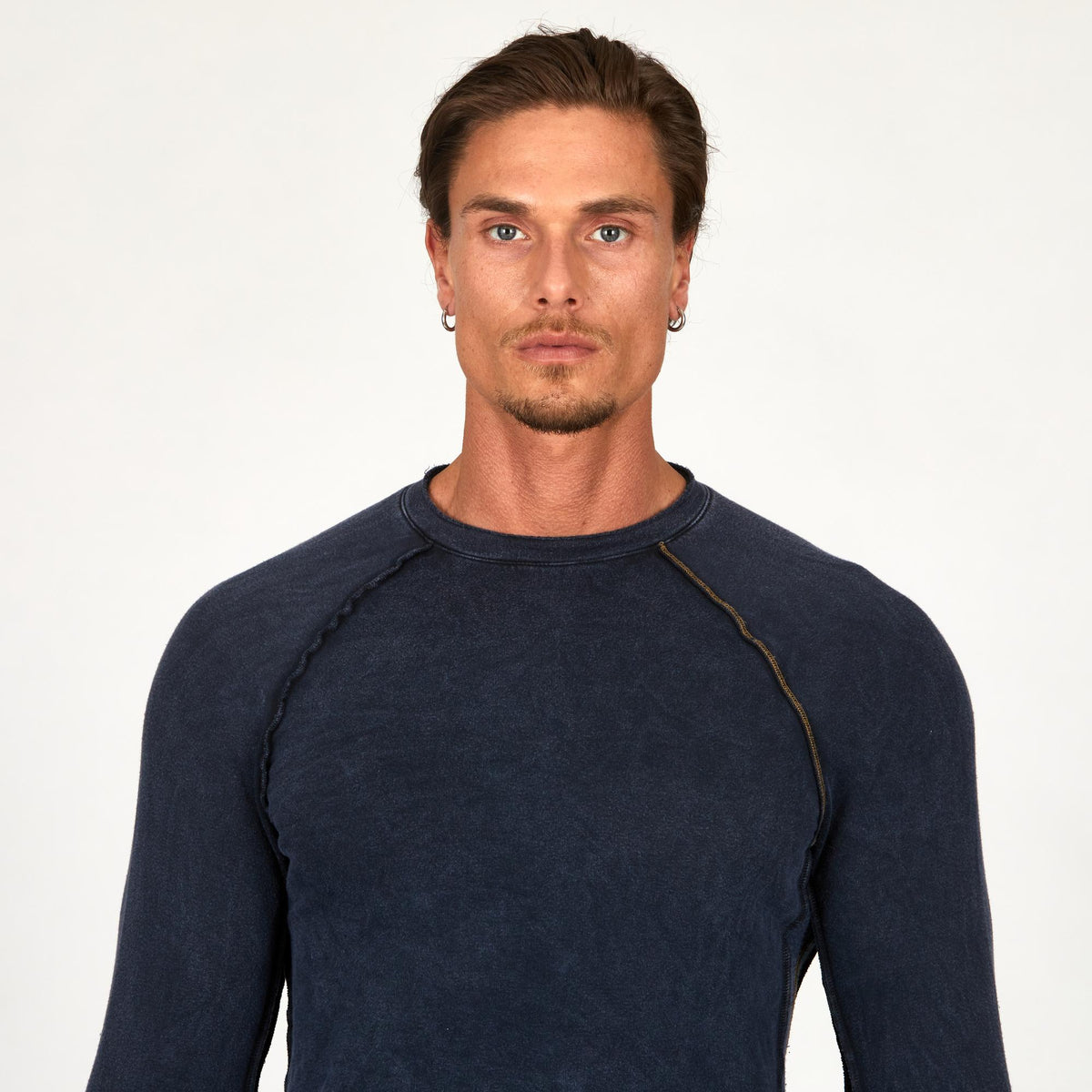 Male modeling dark blue long sleeve raglan
