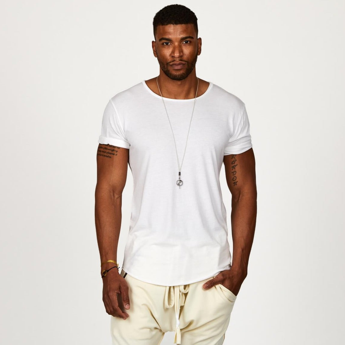 Male modeling white crew neck shirt
