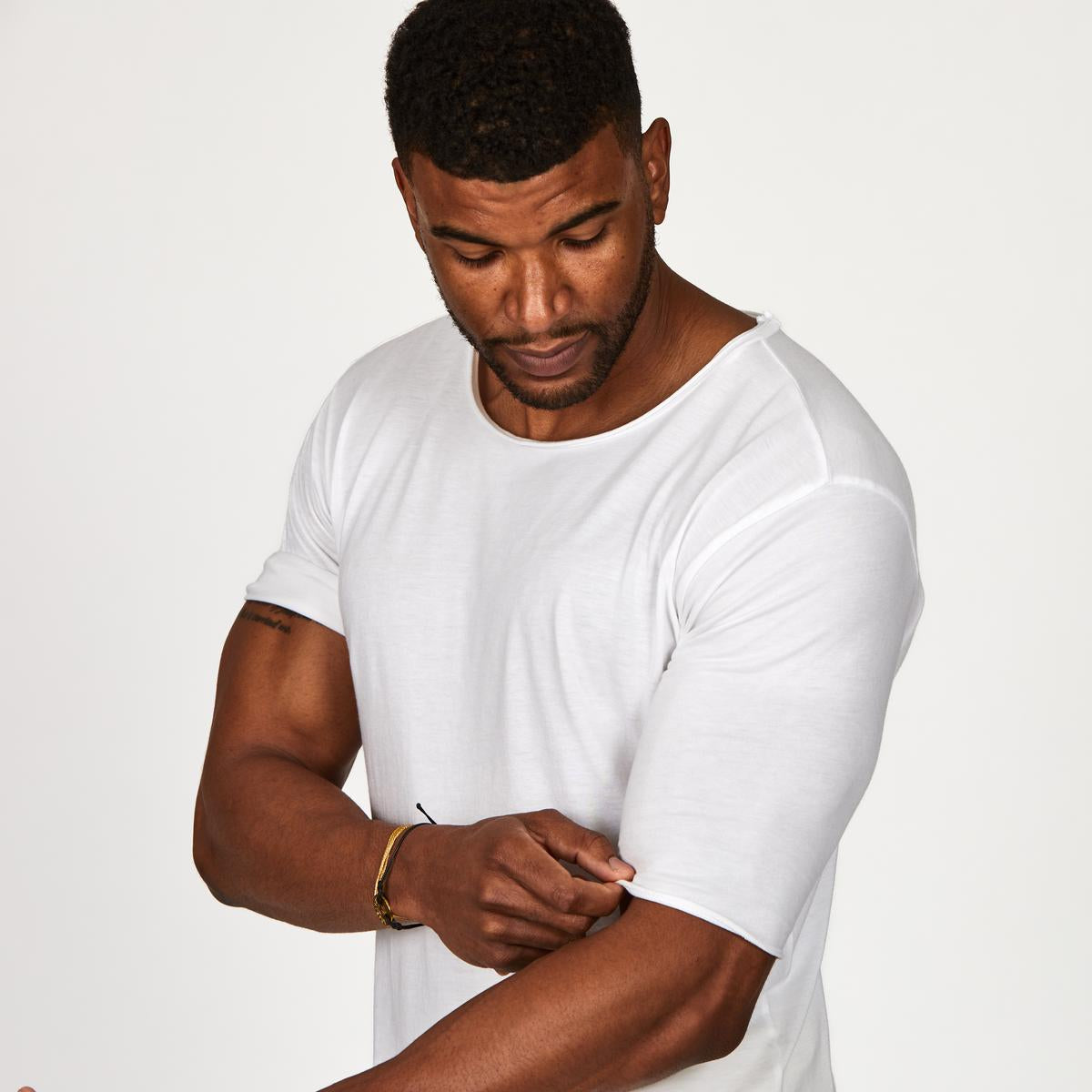 Male modeling white crew neck shirt