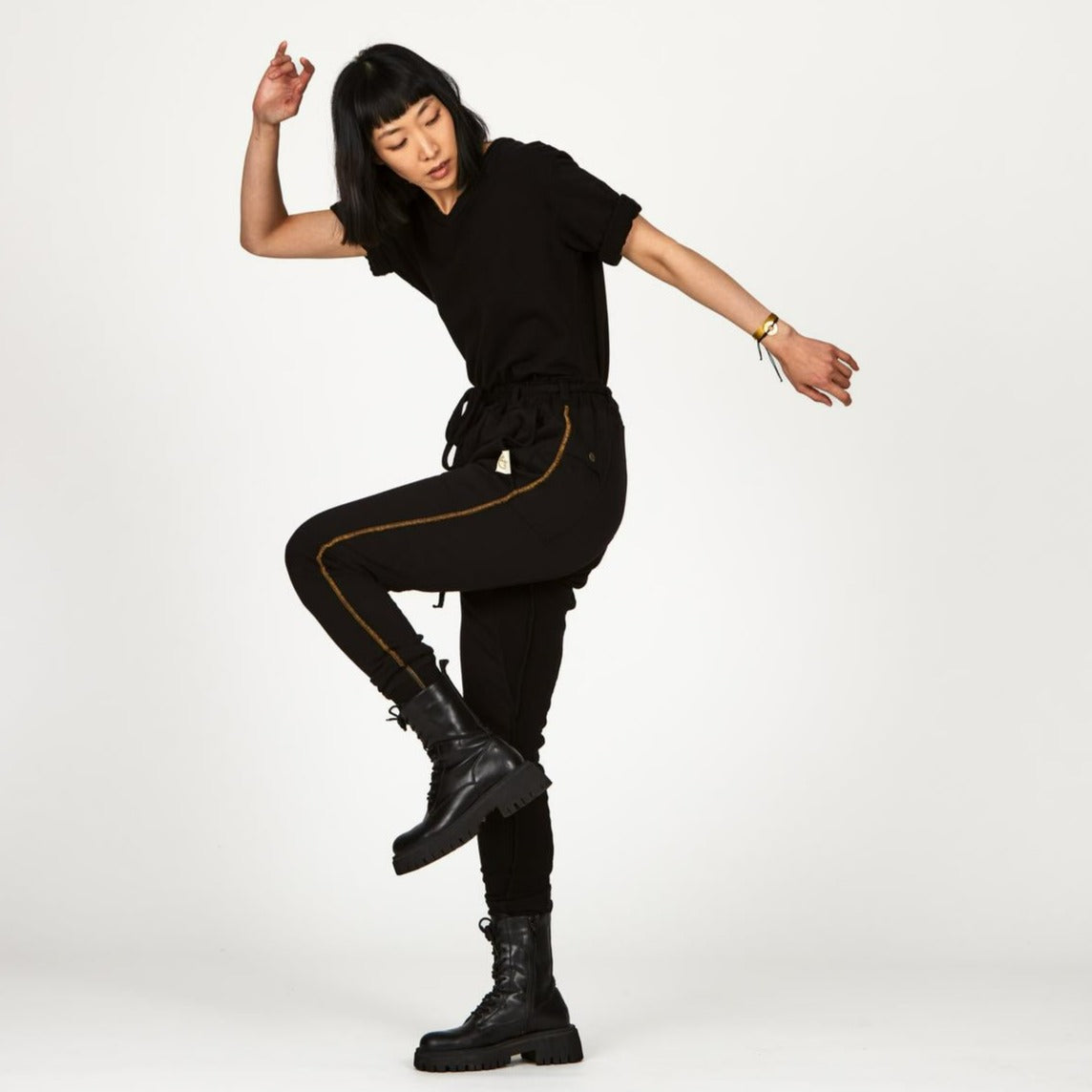 Woman modeling the milano pant in black