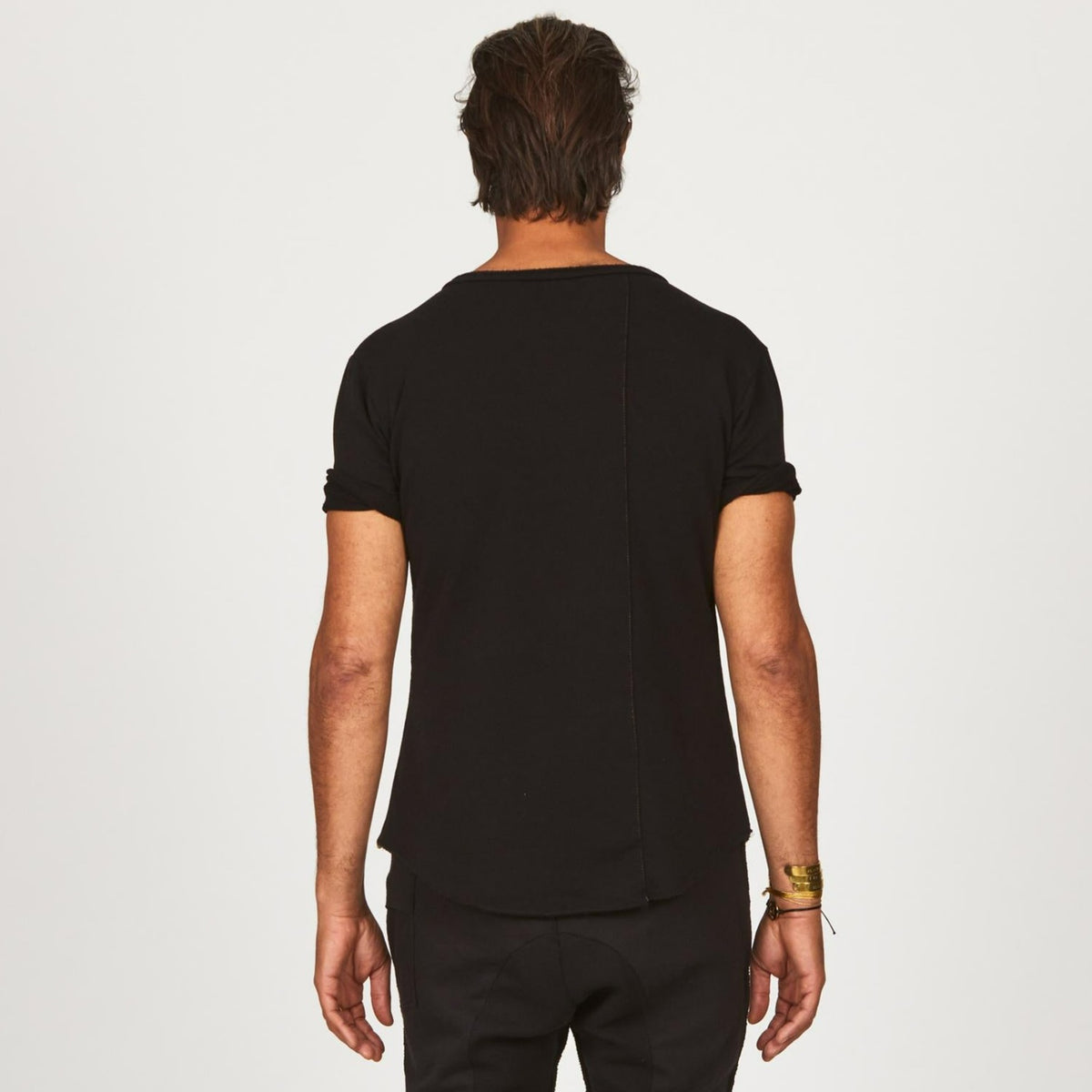 A man modeling in a black sweater v neck shirt