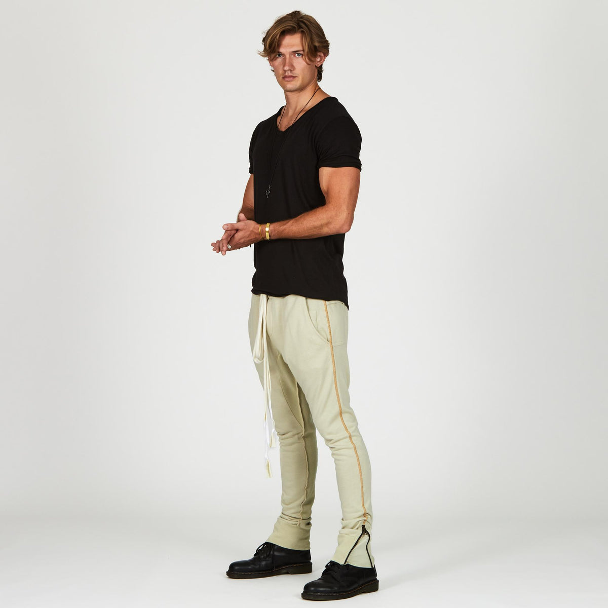 Man modeling the milano pant in ceremony sand