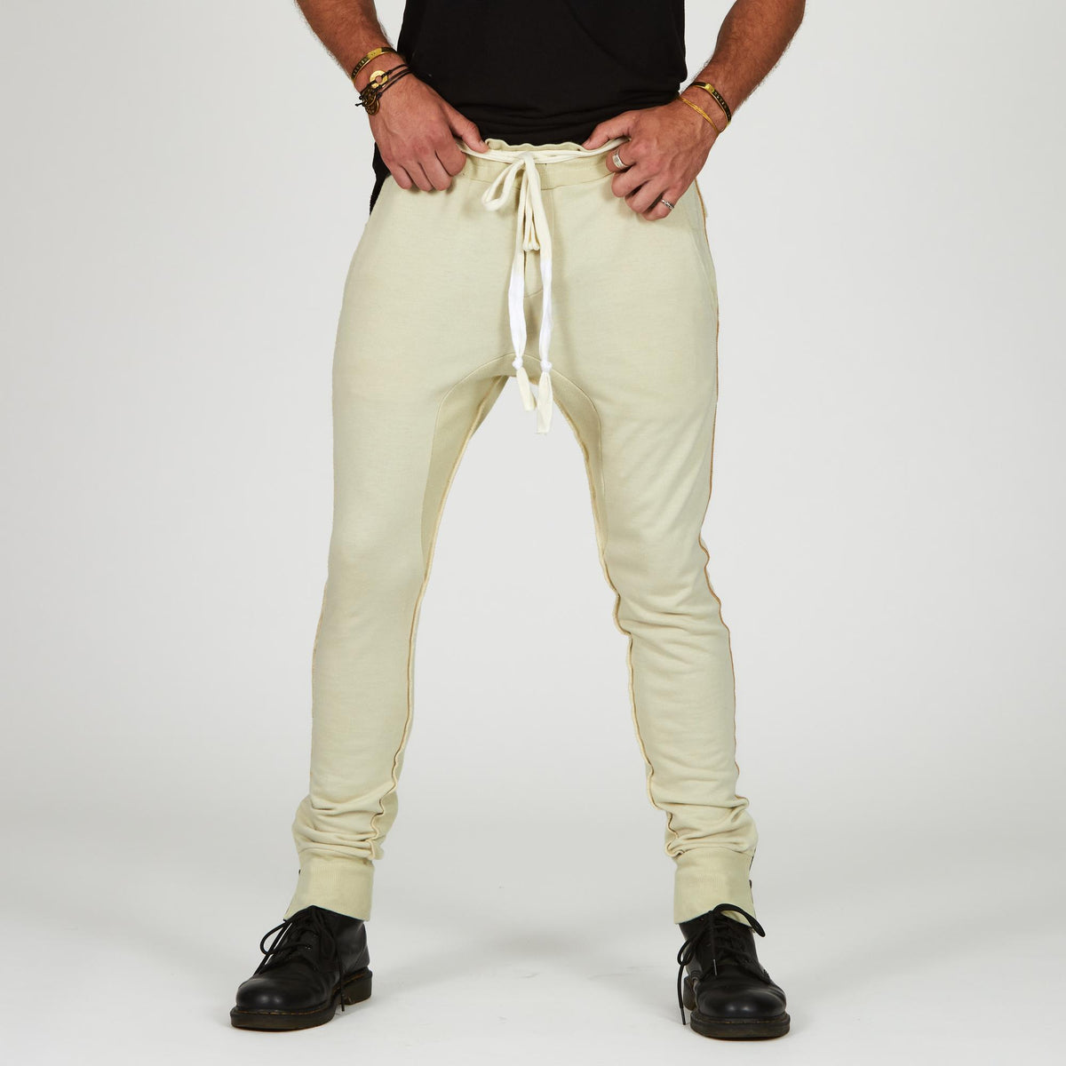 Man modeling the milano pant in ceremony sand