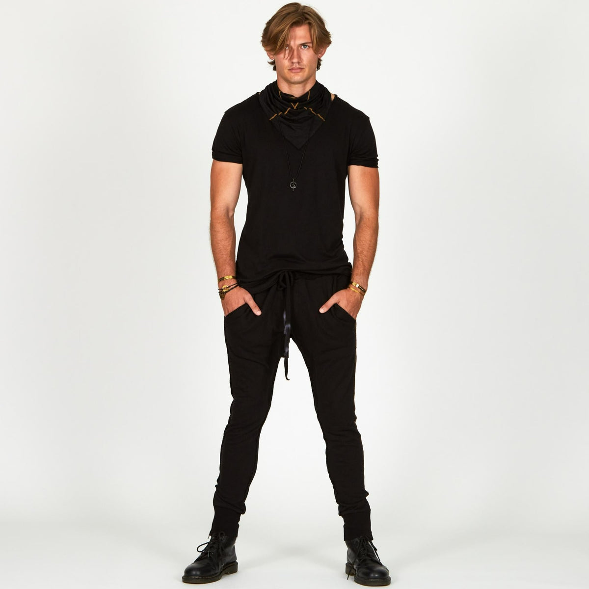 Man modeling a milano pants in black