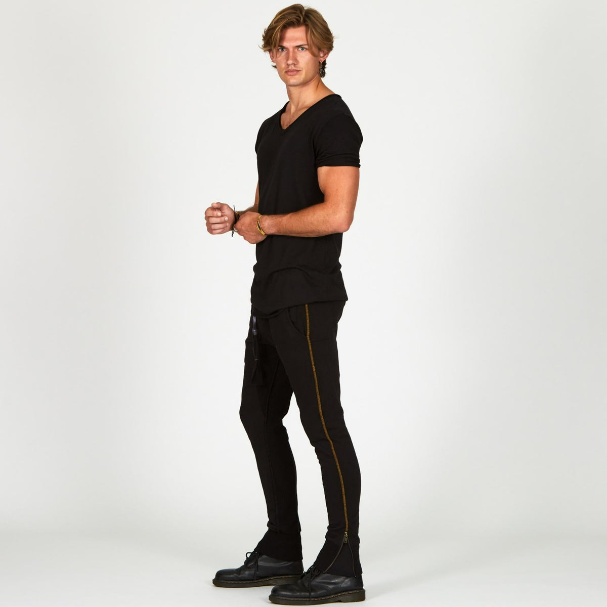 Man modeling a milano pants in black