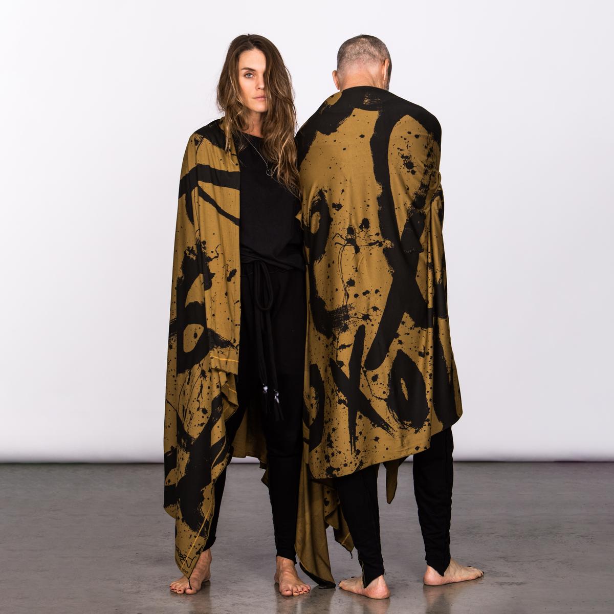 Couple modeling gold Ruben LOVE nature wrap