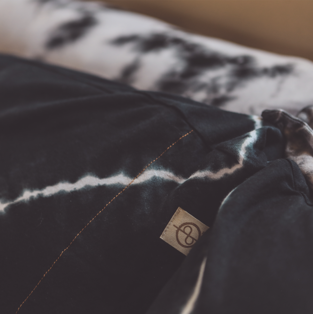 A close up of the One Golden Thread Pillow Face Set in Black Onyx Bolt and Calico Cloud colors